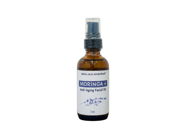 glass Bottle of Moringa anti-aging facial oil on a white background