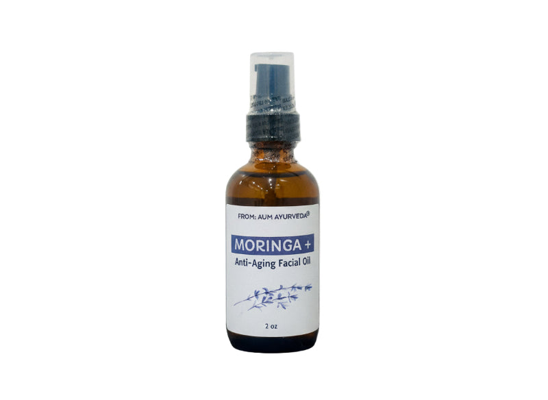 glass Bottle of Moringa anti-aging facial oil on a white background